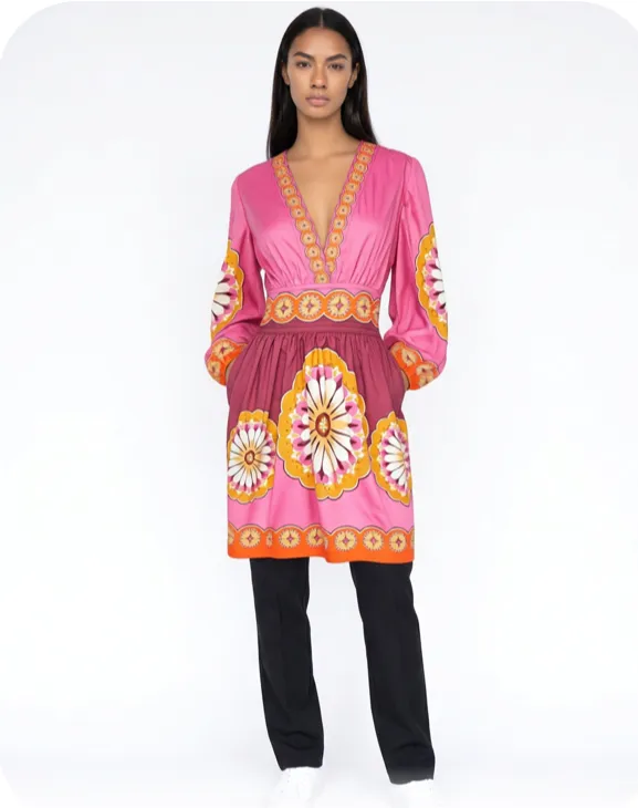 A Flamingo AI avatar wearing a pink printed dress from a capsule wardrobe